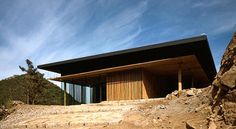 a large building sitting on top of a rocky hillside