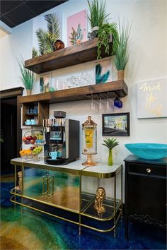 a coffee bar with shelves and plants on the wall above it, along with other items