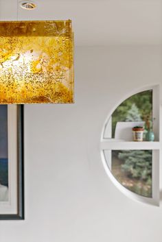 a lamp hanging from the ceiling in a living room