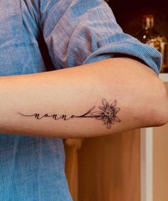 a woman's arm with the word mama written in cursive writing on it