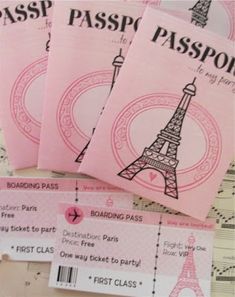 three pink tickets with the eiffel tower in the middle one is for boarding passes