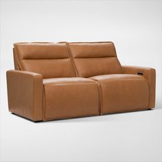 the reclining sofa is made from leather and has two seats, one with an arm rest