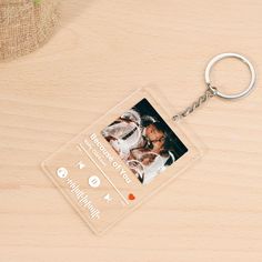 a plastic keychain with a photo on it