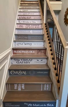 Storage Inside Stairs, Stair Well Wall Art, Stair Way Wall Art, Books Stacked On Stairs, It Ends With Us Apartment, Space Above Stairs Books, Shelf Going Down Stairs, A Room Without Books Is Like, It Ends With Us Stairs