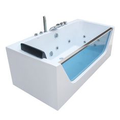 a white bath tub with blue water in it