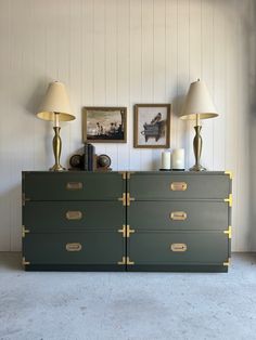 two lamps are sitting on top of a dresser