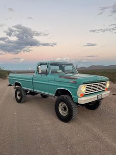 an old pick up truck parked in the desert