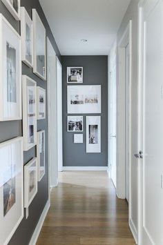 the hallway is decorated with pictures and frames