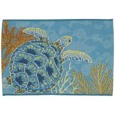 a blue rug with sea turtles and corals on the bottom, in front of an ocean background