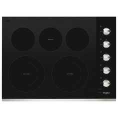 a black stove top with four burners