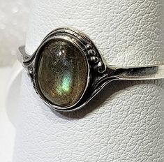 Magical Natural labradorite silver 925 mark ring szs 4-12 cabochon stone size 6 x 8 mm gift box included A semi-precious stone is also known as a gem or gemstone (also a jewel, a gem, a precious stone), which is a portion of mineral, which, in refined and cut form, is used to create jewelry or other embellishments. There are also organic resources or precise rocks that are not minerals (for example jet or amber) that are also used for jewelry and would also be considered to be gemstones, as well Silver Oval Gemstone Cabochons, Adjustable Moonstone Birthstone Ring, Adjustable Moonstone Jewelry With Round Stone, Vintage Oval Cabochon Moonstone Jewelry, Fine Jewelry Adjustable Nickel-free Rings, Adjustable Nickel-free Fine Jewelry Rings, Silver Adjustable Jewelry With Round Stone, Silver Stackable Rings With Gemstone, Collectible Oval Cabochon Moonstone Ring