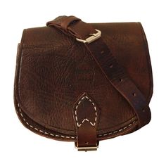 Love our large Saddle Bag but don't need something that big? We have you covered with our small saddle bag. The beautiful full-grain leather of this bag is tough enough to stand up to being used all day everyday and will only look better with age. With an inside compartment and a zipped pocket, this is a great bag for when you just need to carry those essentials. The Strong metal buckle will keep all your items secure and the cross-body strap makes this a comfortable bag to wear through the day Handmade Leather Bag, Moroccan Leather, Stocking Fillers For Her, Forever Jewelry, Brown Colour, Leather Bags Handmade, Long Haul, Handmade Bag, Saddle Bag