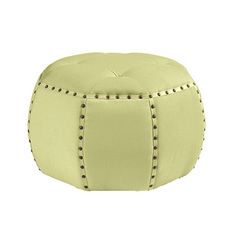 a white ottoman with studded trimmings on the top and bottom, sitting in front of a white background