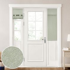 a white front door with green blinds and matching shades on the windowsill, next to a side table