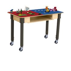 a wooden table with legos on it and wheels attached to the legs that are not in use