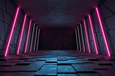 an empty room with pink neon lights on the walls and floor, along with black tiles