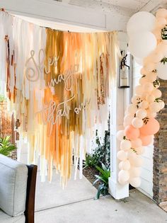 an outdoor party with balloons and streamers