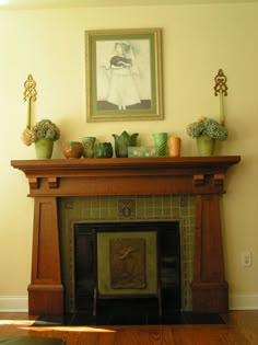 a fireplace in a living room with potted plants on top of the mantel