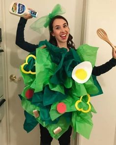 a woman is dressed up like a christmas tree