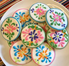 colorful decorated cookies on a white plate