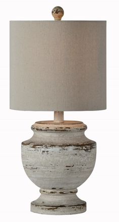 a white table lamp with a beige shade on the base and a light brown shade on the top