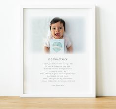 a white framed photo with a baby's name on it