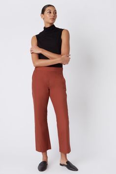 Fall calls for ease with our elastic waist Brit Crop Pant. With a mid-rise fit, angle seam pockets and the perfect leg opening, this style is a breeze to wear in the cooler weather. Pair it with your favorite ankle boot or sneaker, this style is designed for women on the go.THIS ITEM IS FINAL SALE. 1.5" front waistband, elastic at sides and back, angle seams with front pockets, midrise, easy fit, clean finish hem. - 51% Cotton, 49% Nylon - Fabric Woven in Italy - Made in NYC - Professional dry c Fitted Straight Pants With Pull-on Style, Casual Straight Leg Pull-on Dress Pants, Spring Casual Pull-on Dress Pants, Casual Pull-on Straight Leg Dress Pants, Casual Straight Leg Dress Pants With Pull-on Style, Versatile Solid Pants With Elastic Side Panels, Casual Full-length Pants With 4-way Stretch, Straight Leg Dress Pants With Elastic Waistband, Versatile Straight Pants With 4-way Stretch