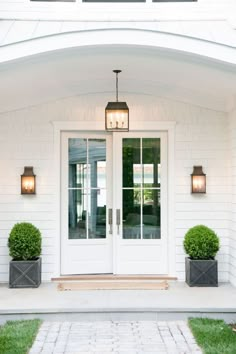 two planters on either side of the front door