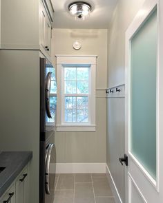 this is an image of a laundry room with washer and dryer in it