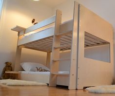 there is a bunk bed with no mattresses on the top and bottom bunk beds