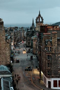 an aerial view of a city street at dusk