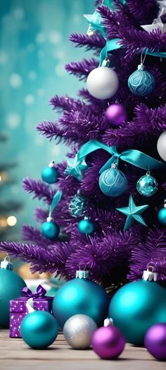 a purple christmas tree with blue and silver ornaments