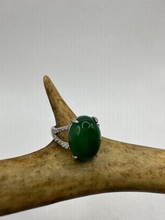 vintage green fun jade ring  Setting is a silver finished bronze setting  This is one of my hand re finished treasures. Salvaged from vintage.  Size  7 Re sizing can be done for a $20 fee and may take up to a week.  Engraving is $4 per letter.  Thank you for supporting a veteran's small business. All jewelry is shipped free within the US in a stylish gift box Oval Green Diamond Gemstones, Elegant Oval Cabochon Jade Jewelry, Elegant Green Emerald Ring With Stones, Oval Diamond Jewelry With Stones, Formal Oval Jade Emerald Ring, Oval Green Gemstones For Formal Occasions, Oval Emerald Gemstones With Accents, Luxury Oval Emerald Ring With Stone Setting, Oval Emerald Ring With Diamond Gemstone Accents