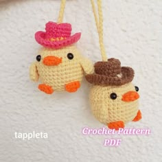 two crocheted ducks wearing hats hanging from strings on a white surface with text that reads, crochet pattern pdf