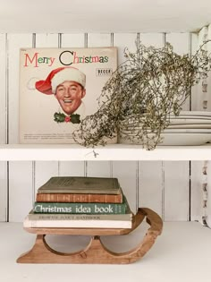 two shelves with christmas books on them