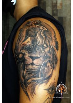 a man with a lion tattoo on his arm