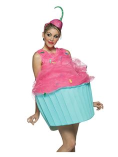 a woman in a pink dress and hat with a cupcake on her head