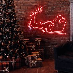 a christmas tree and presents in front of a brick wall with a neon sign that says santa sleigh