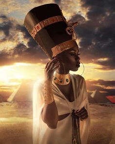 an egyptian woman with a hat and jewelry on her head in front of the sun