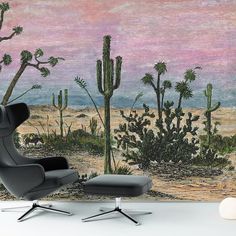 a wall mural with cactus trees in the desert