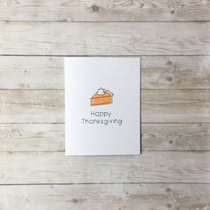 a greeting card with the words happy thanksgiving written on it and a piece of cake