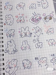 an open notebook with various stickers on the pages and in front of it are drawings of animals