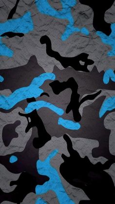 a blue and black camouflage print on a gray background that looks like it has been made out of paper