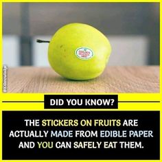 a green apple sitting on top of a wooden table next to a sign that says did you know? the stickers on fruits are actually made from edible paper and you can safely eat them