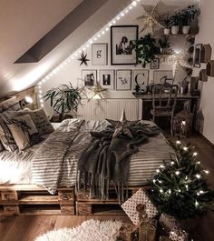 an image of a bedroom with pictures on the wall