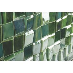 a close up view of some green tiles