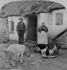 an old black and white photo of people with animals