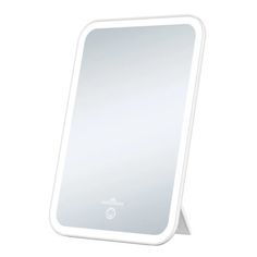 a white mirror sitting on top of a table