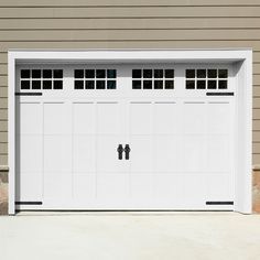 a white garage door with two windows on the side