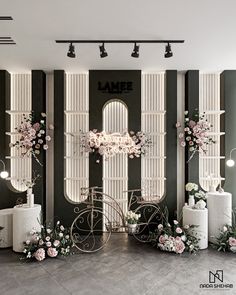 a room decorated in black and white with flowers